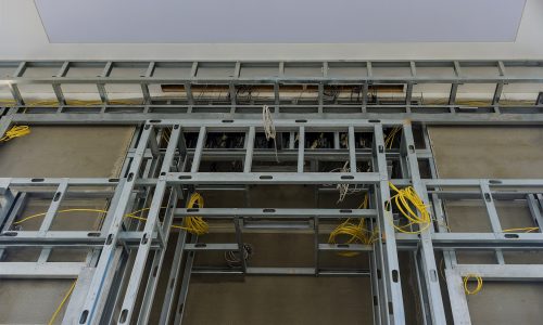 Steel studs beams used to frame in a large commercial building